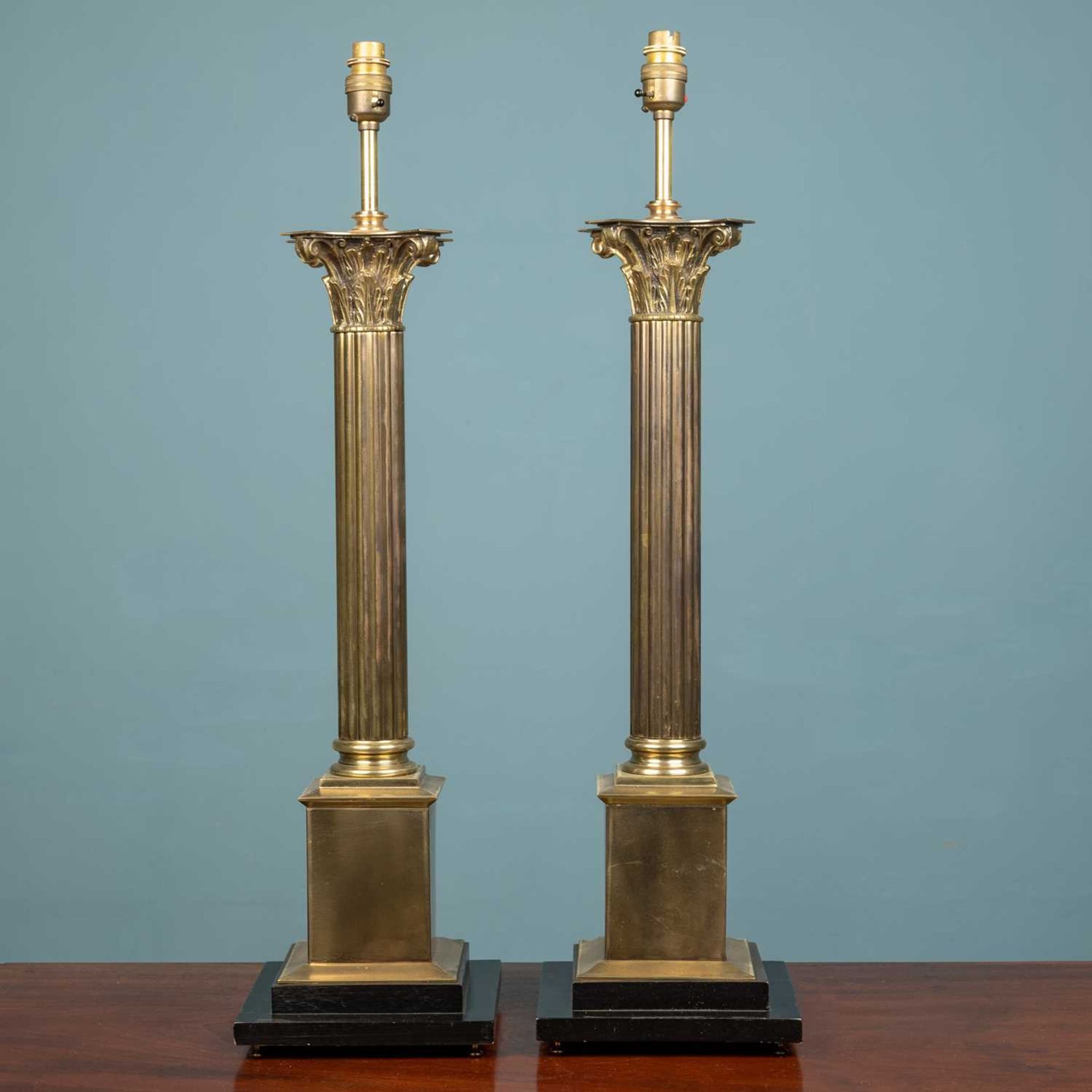 A pair of large corinthian table lamps