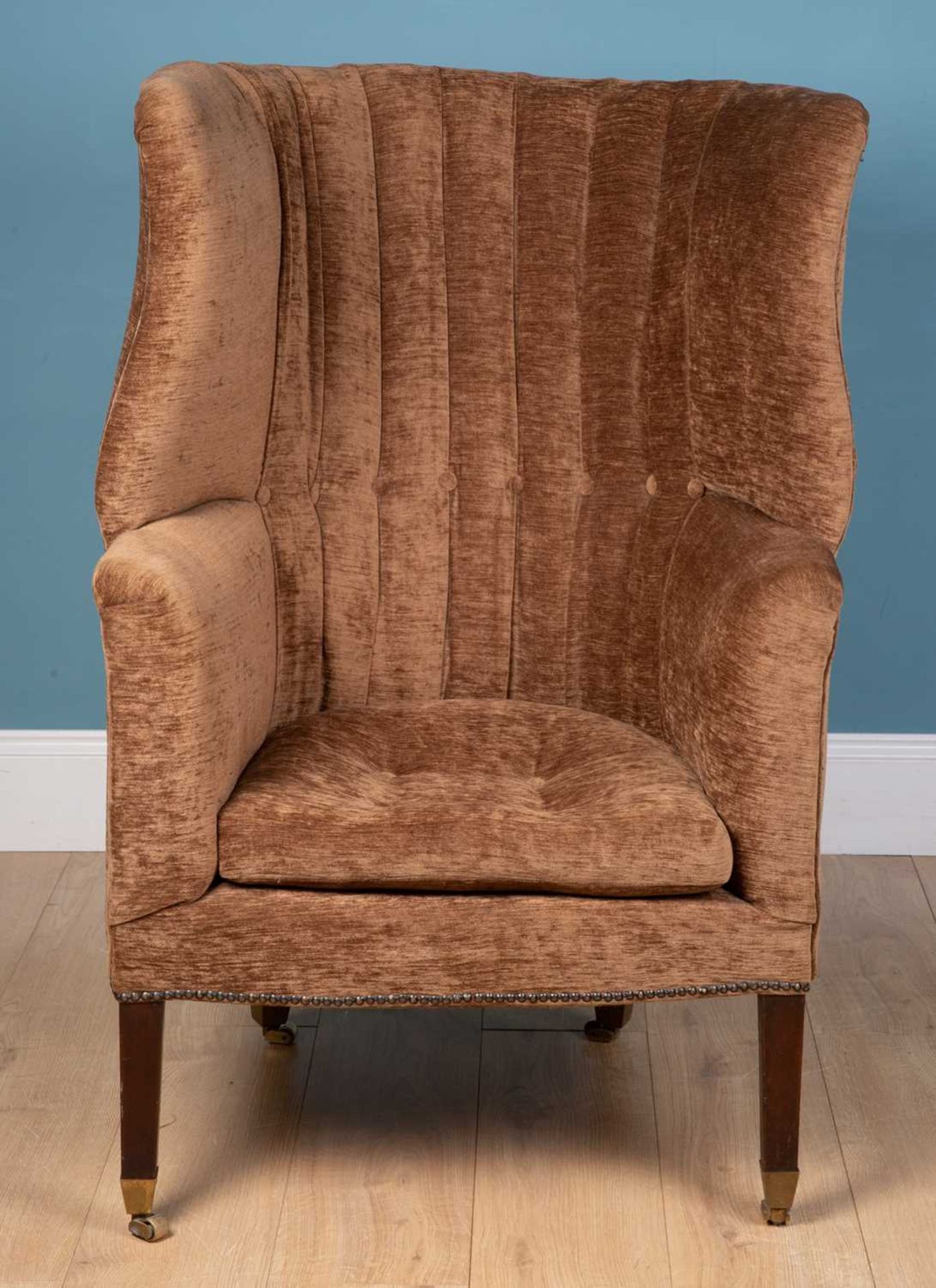 An antique wingback armchair