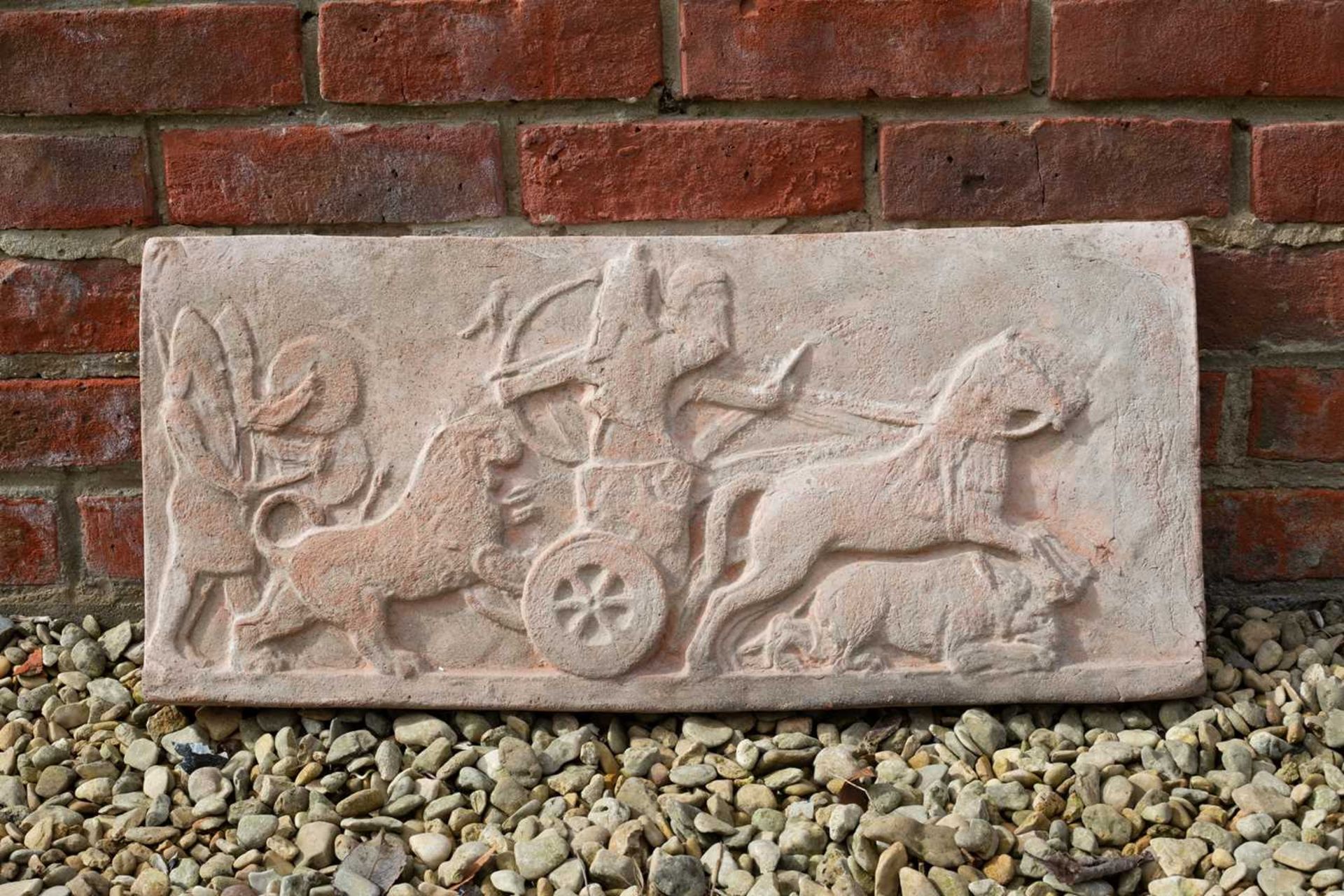 An Assyrian style terracotta wall plaque