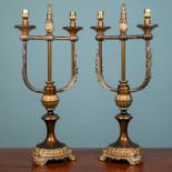 A pair of continental Empire style lamp stands