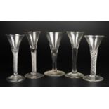 A group of five antique wine glasses