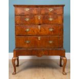 A George II walnut chest on stand