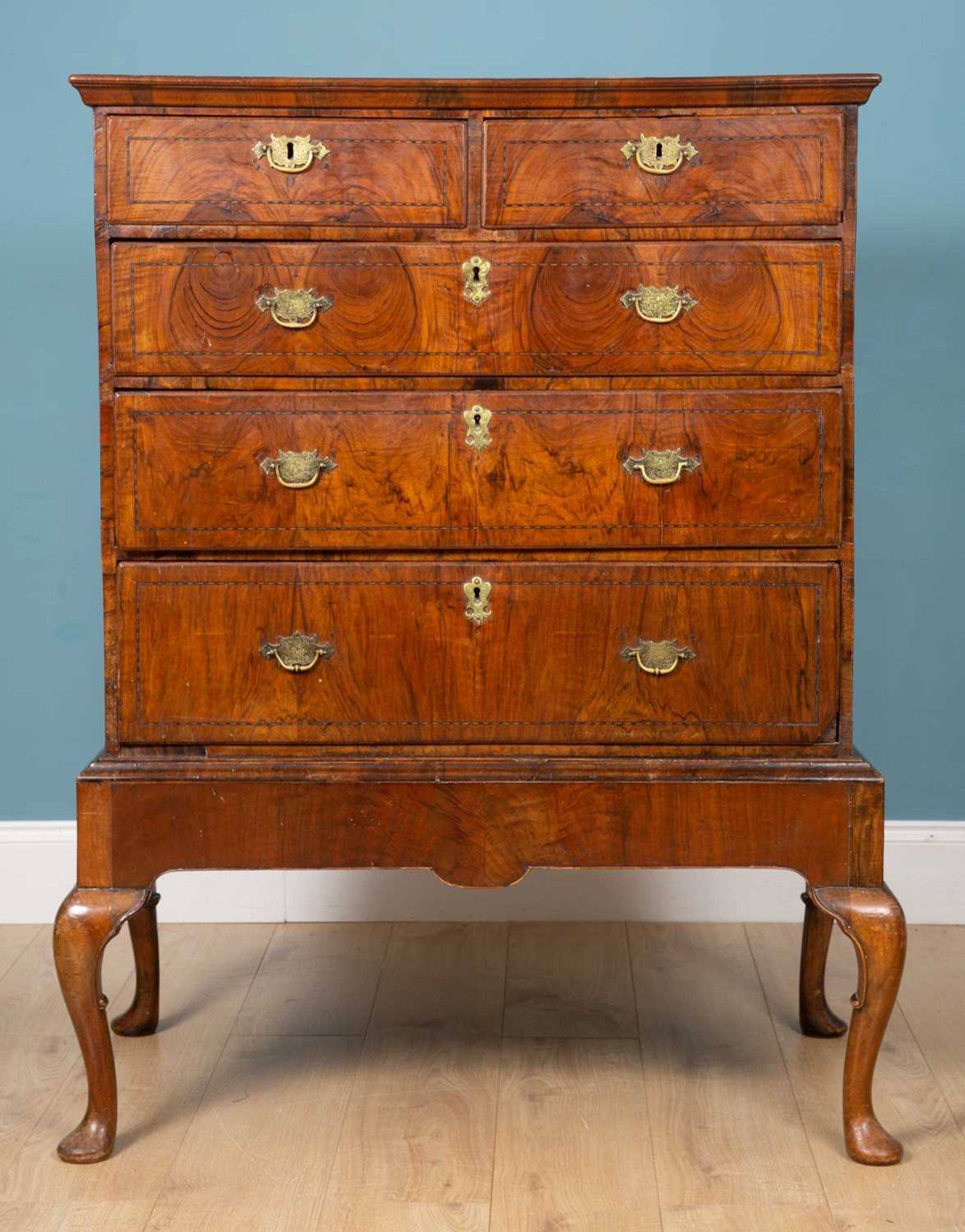 A George II walnut chest on stand