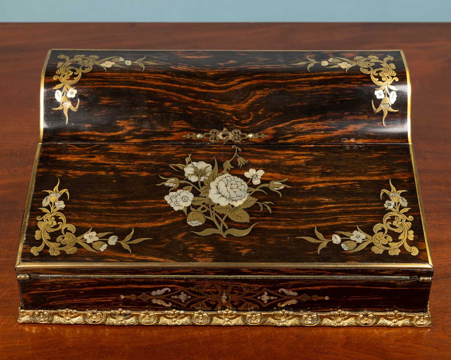 A Victorian coromandel veneered and mahogany sloped writing box