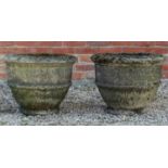 A pair of cast reconstituted stone garden urns
