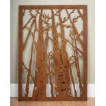 A pierced steel silhouette picture of autumn woodland trees