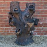 A Victorian stoneware faux tree trunk planter
