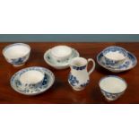 A small group of 18th century porcelain tea bowls and a sparrow beak jug