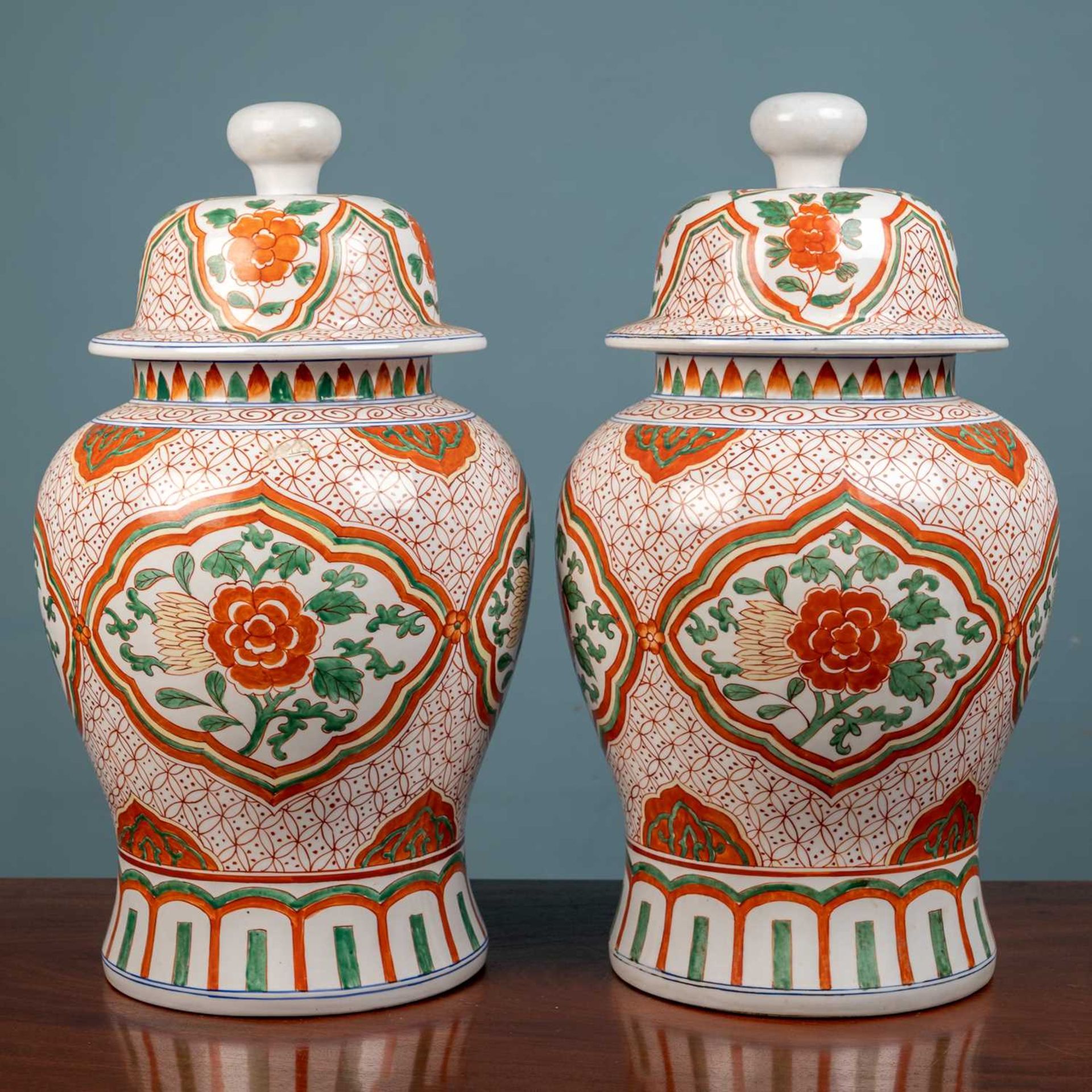 A pair of Chinese lidded floor vases