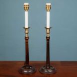 A pair of Georgian style wooden fluted 'candlestick' lampstands