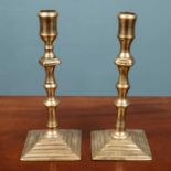 A pair of Georgian brass candlesticks