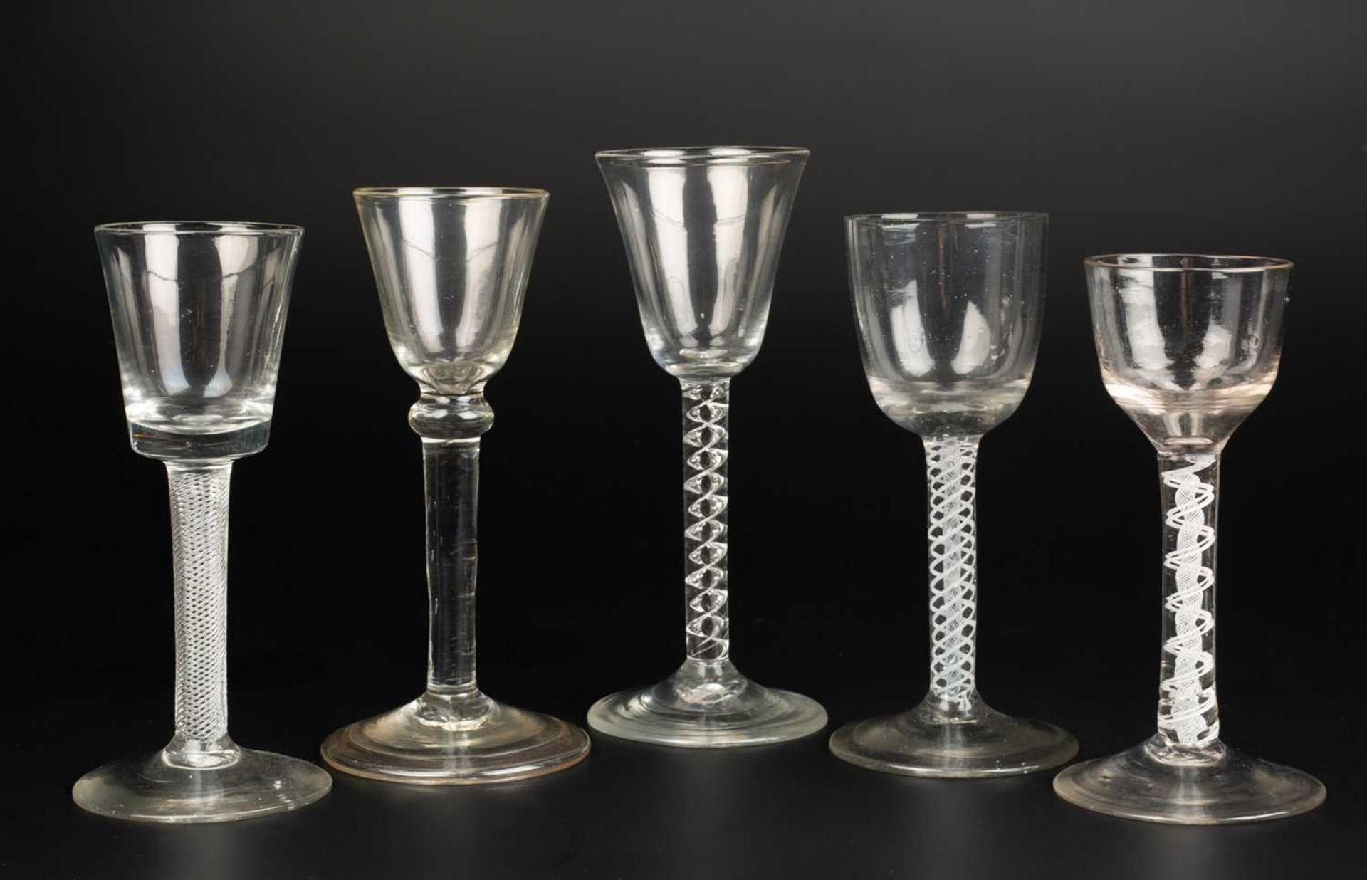 A group of five antique wine glasses