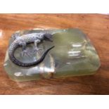 An onyx dish mounted with a cold painted bronze sculpture of a lizard
