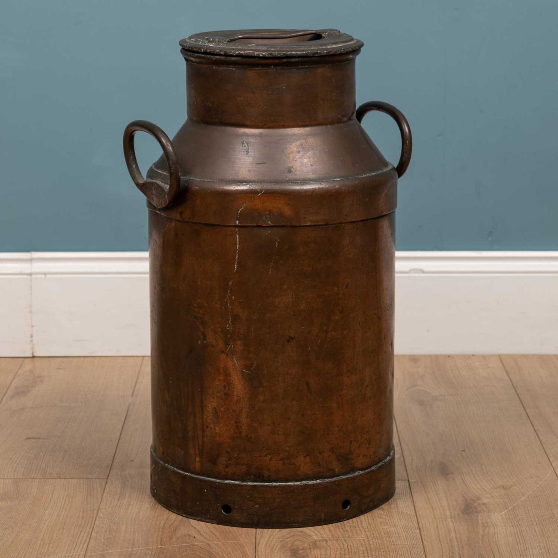 A 19th century copper milk churn