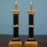 A pair of painted wooden chinoiserie style or cluster column table lamps