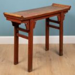 A Chinese softwood red lacquered small altar table