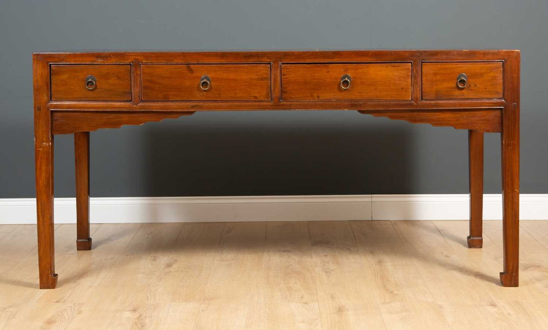 A Chinese elm four drawer side table