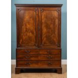 A George III and later mahogany linen press