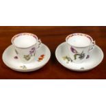 A pair of Meissen coffee cups and saucers