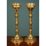 A pair of Gothic style brass pricket candlesticks