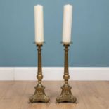 A pair of large brass candlesticks