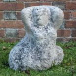 A weathered stone sculpture of a mermaid