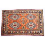 A Middle Eastern Sarough red ground rug