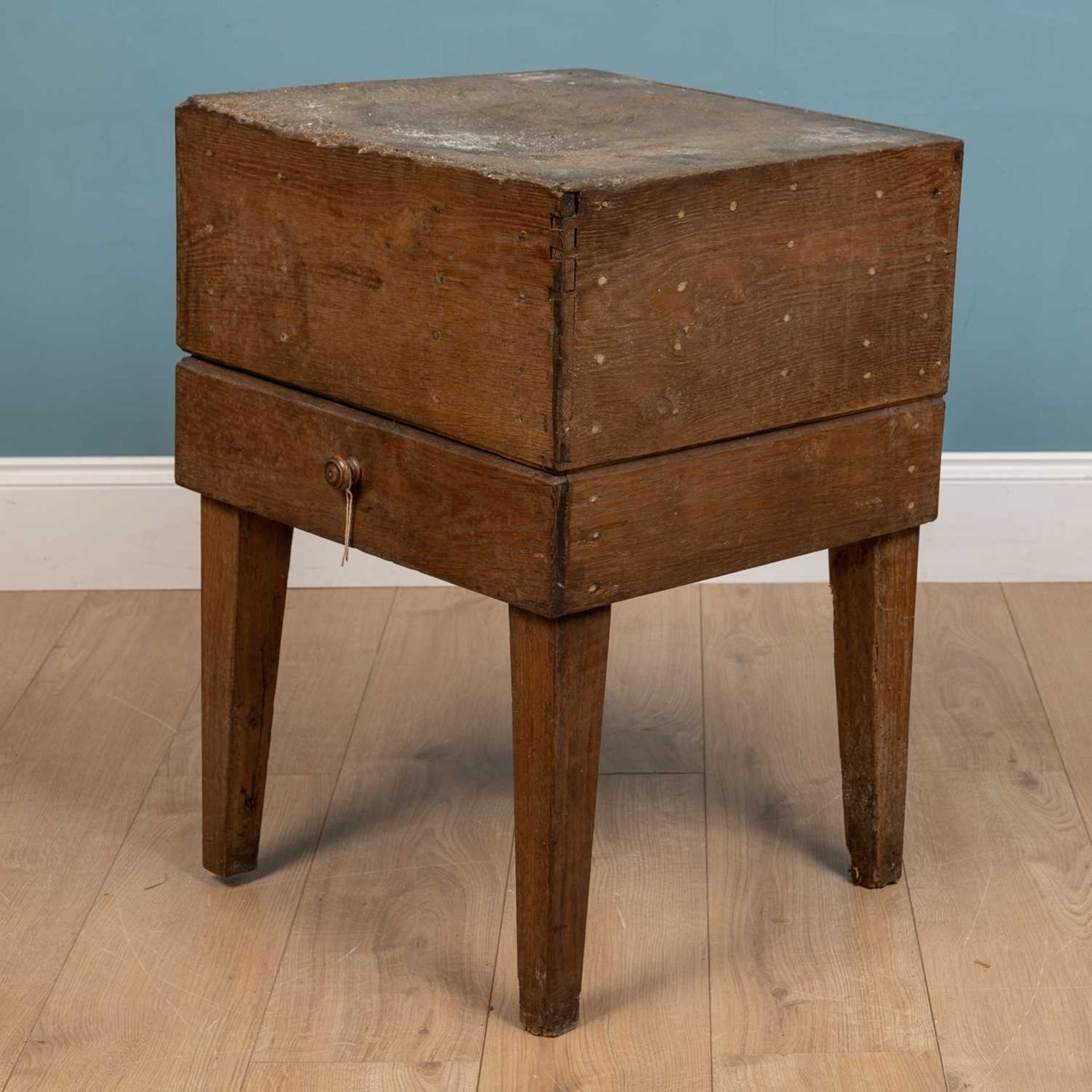 A 19th century oak square butchers block