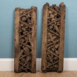 A pair of English oak carved panels