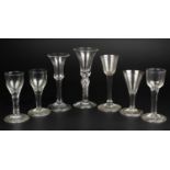 A collection of seven antique wine glasses