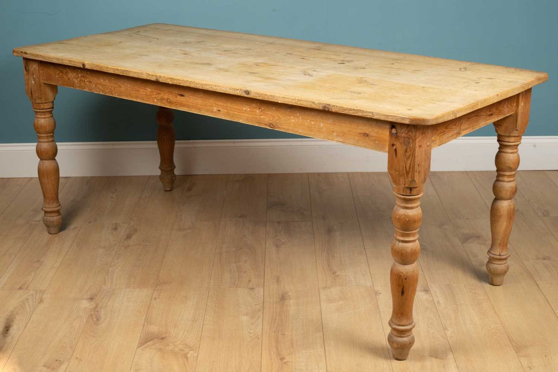 A large pine kitchen table