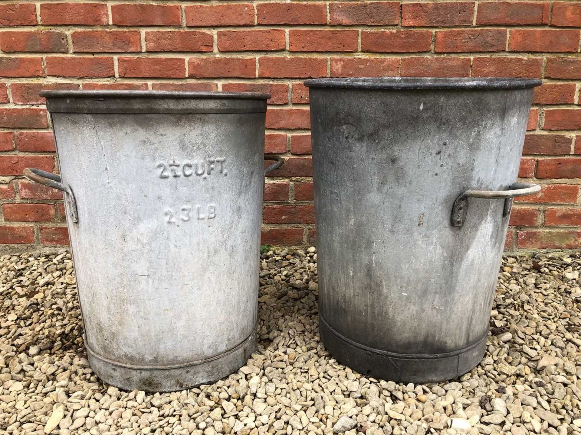 A pair of vintage two handled galvanised bins