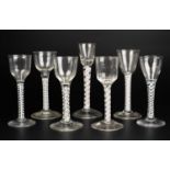 A group of seven antique lace twist cordial and wine glasses