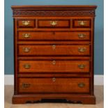 A 19th century oak chest of three short and four long graduated drawer