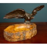 A carved hardstone dish mounted with a bronze sculpture of an eagle