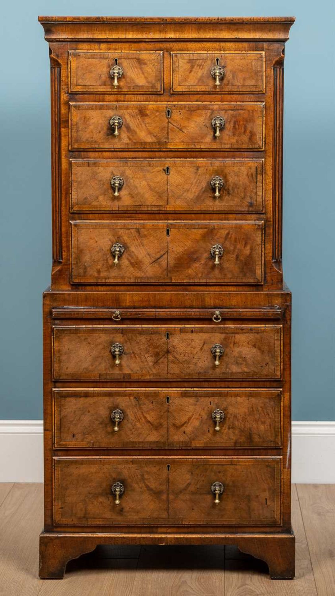 An 18th century style small sized walnut chest on chest