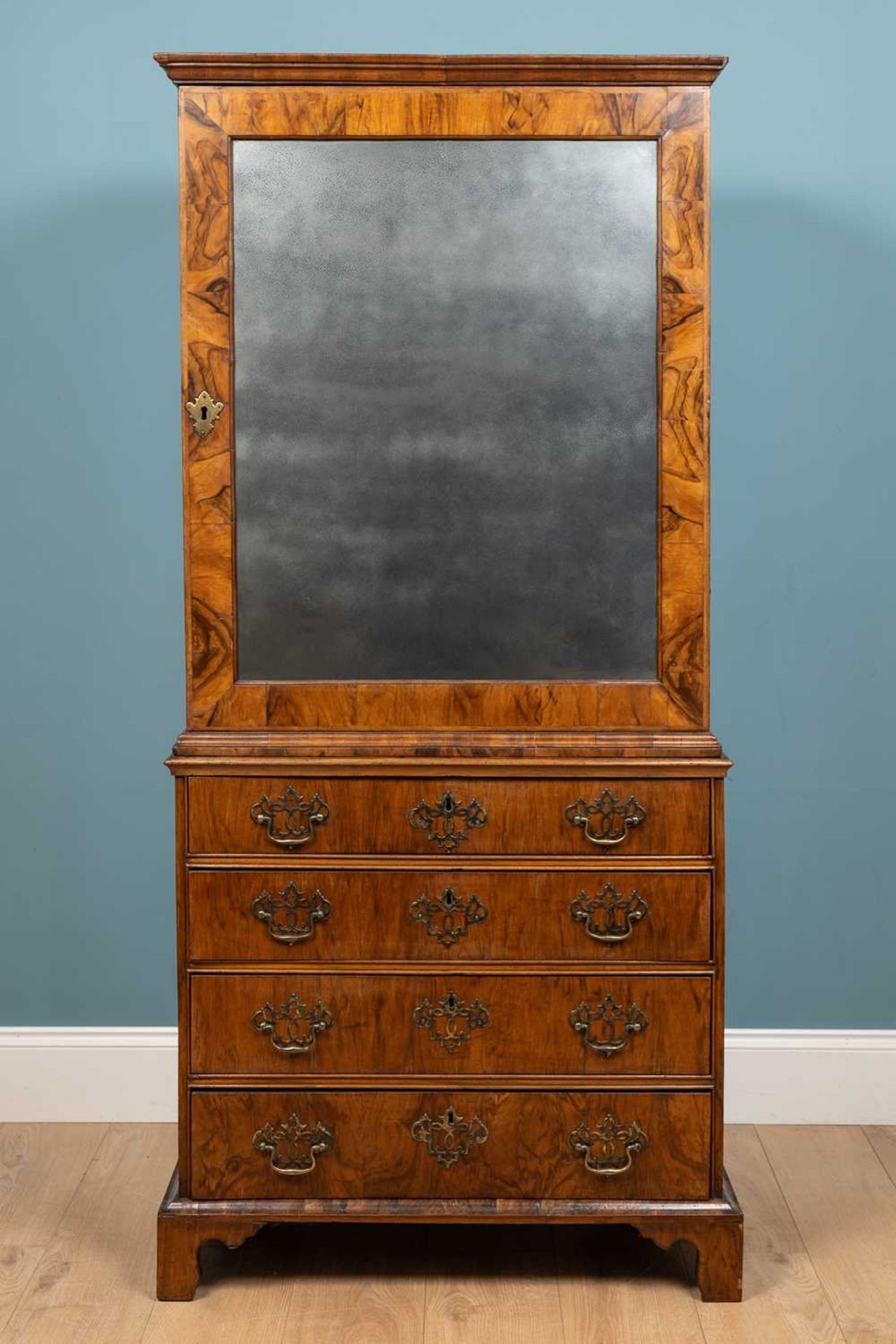 An 18th century walnut cabinet on chest