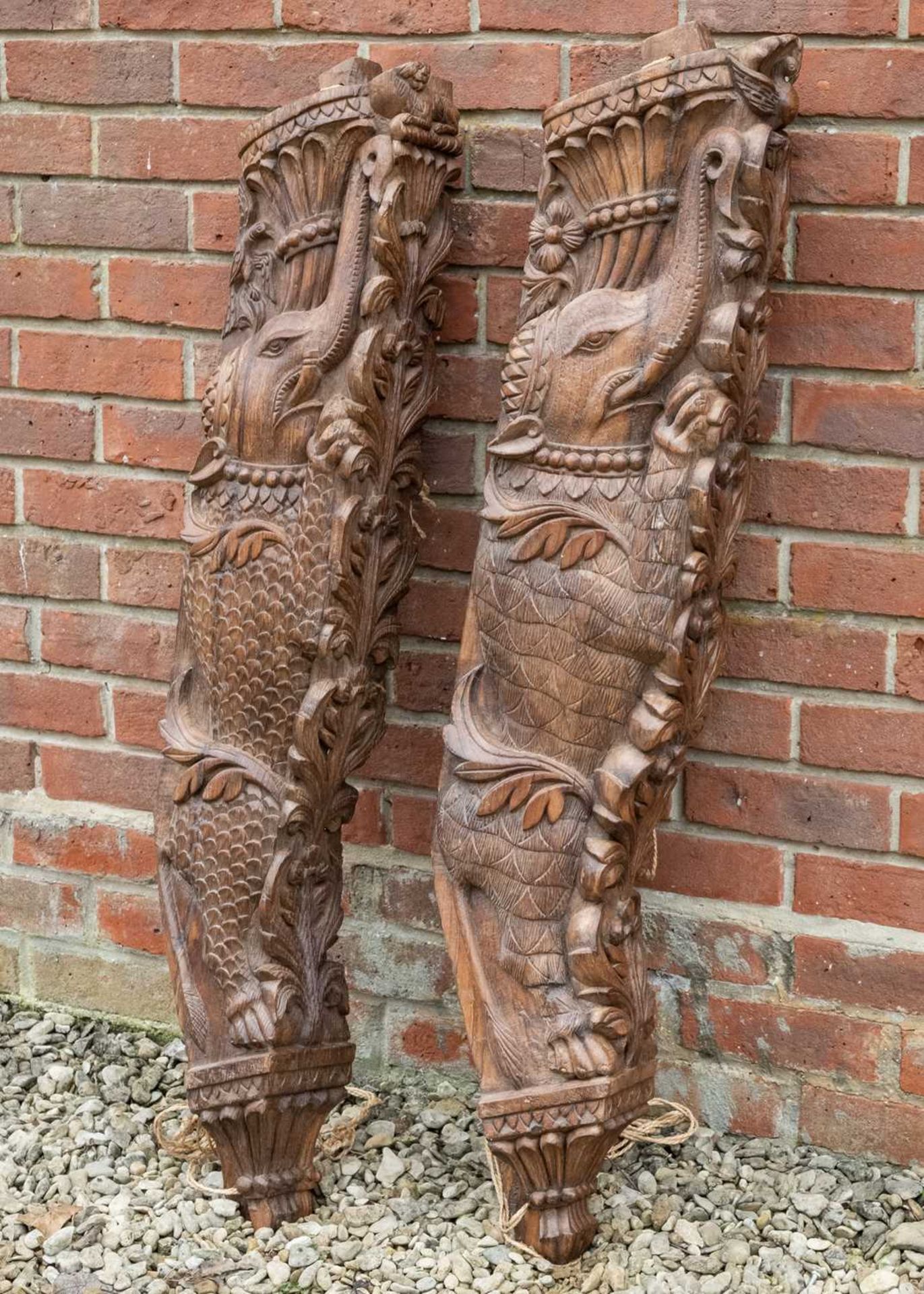 A pair of carved Indian hardwood architectural brackets
