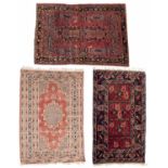 A Persian wine ground rug