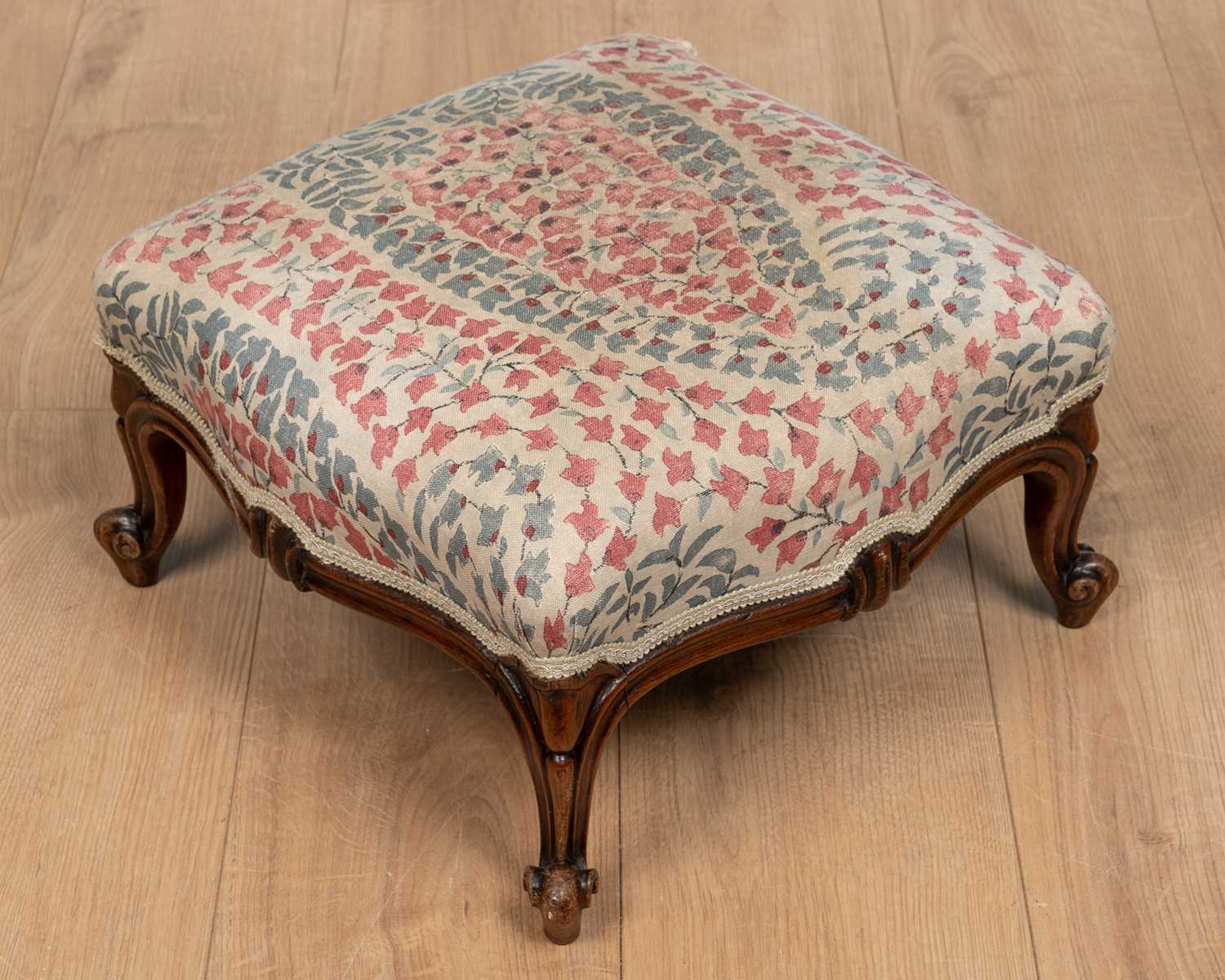 A small Victorian rosewood footstool