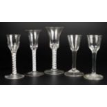 A collection of five antique wine glasses