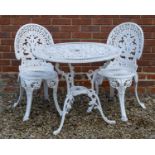 A cast aluminium circular garden table and two chairs