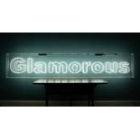 A large neon 'Glamorous' sign