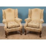 A pair of 19th century wingback armchairs