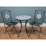 A wrought iron bistro table