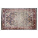 An Indian blue and red ground part silk rug