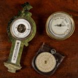 Two antique marine barometers, one wall hanging with a green marble effect and black to the reverse,