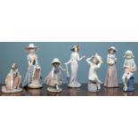 A Lladro figurine, five Nao figurines and a further one signed JMC and dated 1993, the tallest 26.