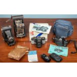 A collection of vintage cameras, to include one Yashica FX-3 Super 2000 camera in a blue bag with