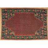 A Persian rug with a pink floral motif, 210cm x 144cmPurchased from Christopher LeggeGood used